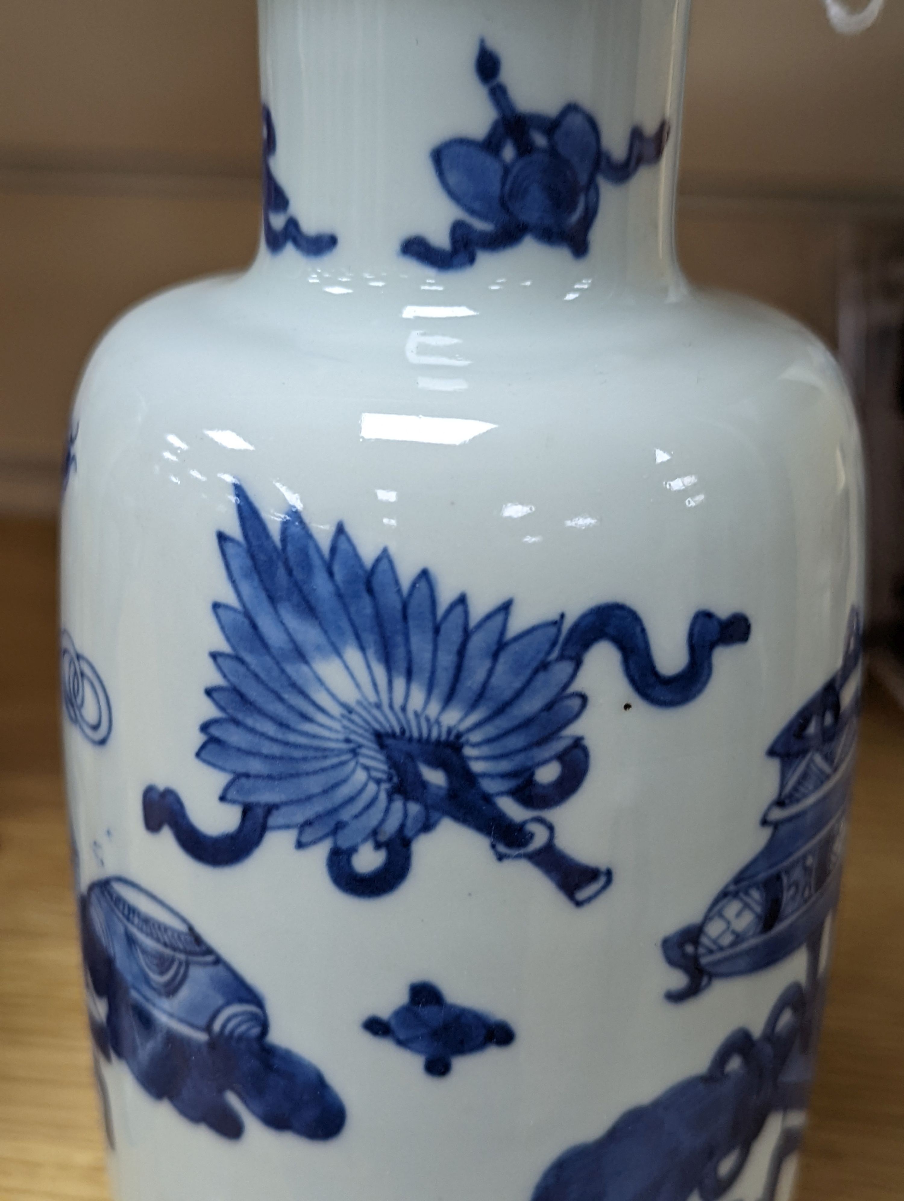 A Chinese blue and white ‘Antiques’ vase, 19.5 cms high.